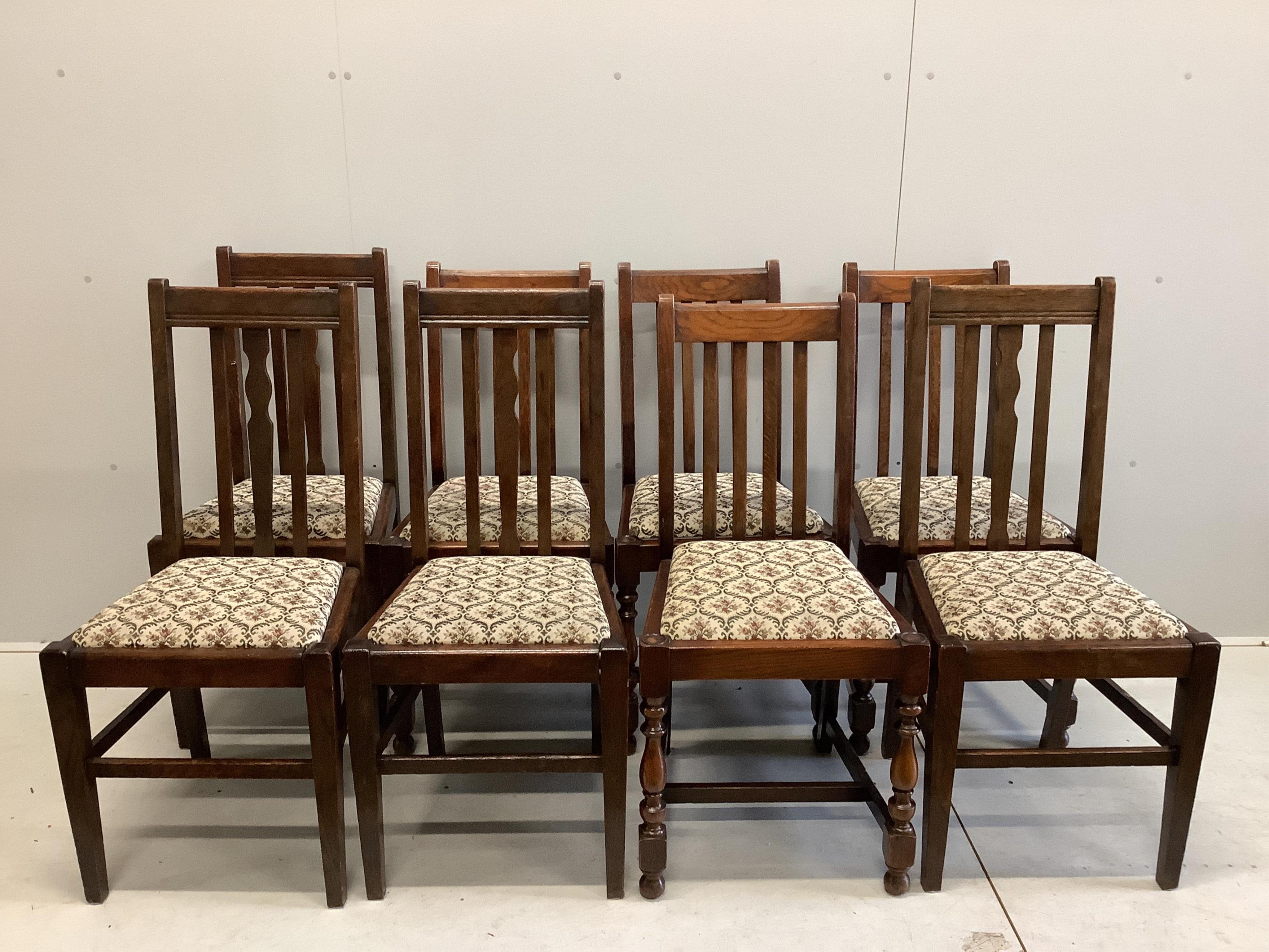 A rectangular hardwood refectory dining table, width 214cm, depth 89cm, height 71cm, together with eight early 20th century oak dining chairs. Condition - fair to good